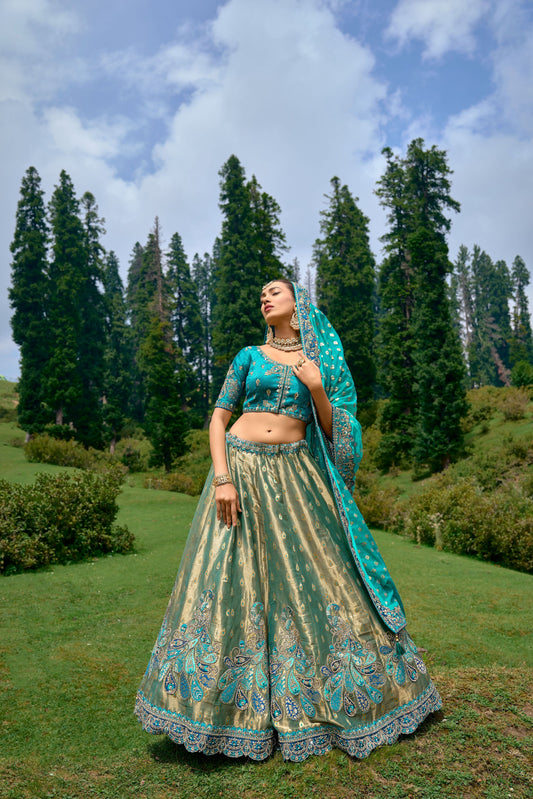 Teal Blue Color Silk Heavy Embroidered Lehenga Choli - Rent