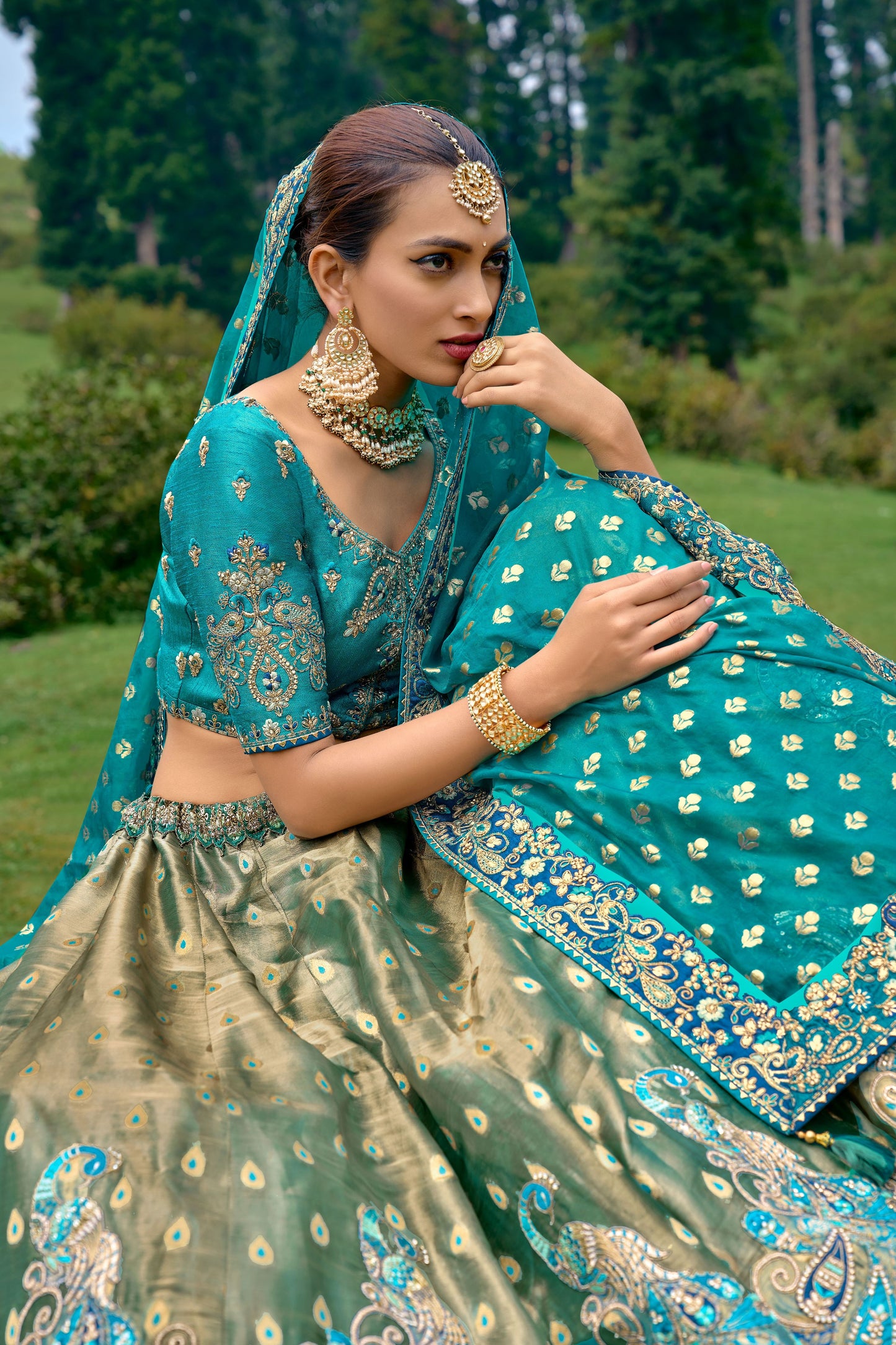 Teal Blue Color Silk Heavy Embroidered Lehenga Choli - Rent