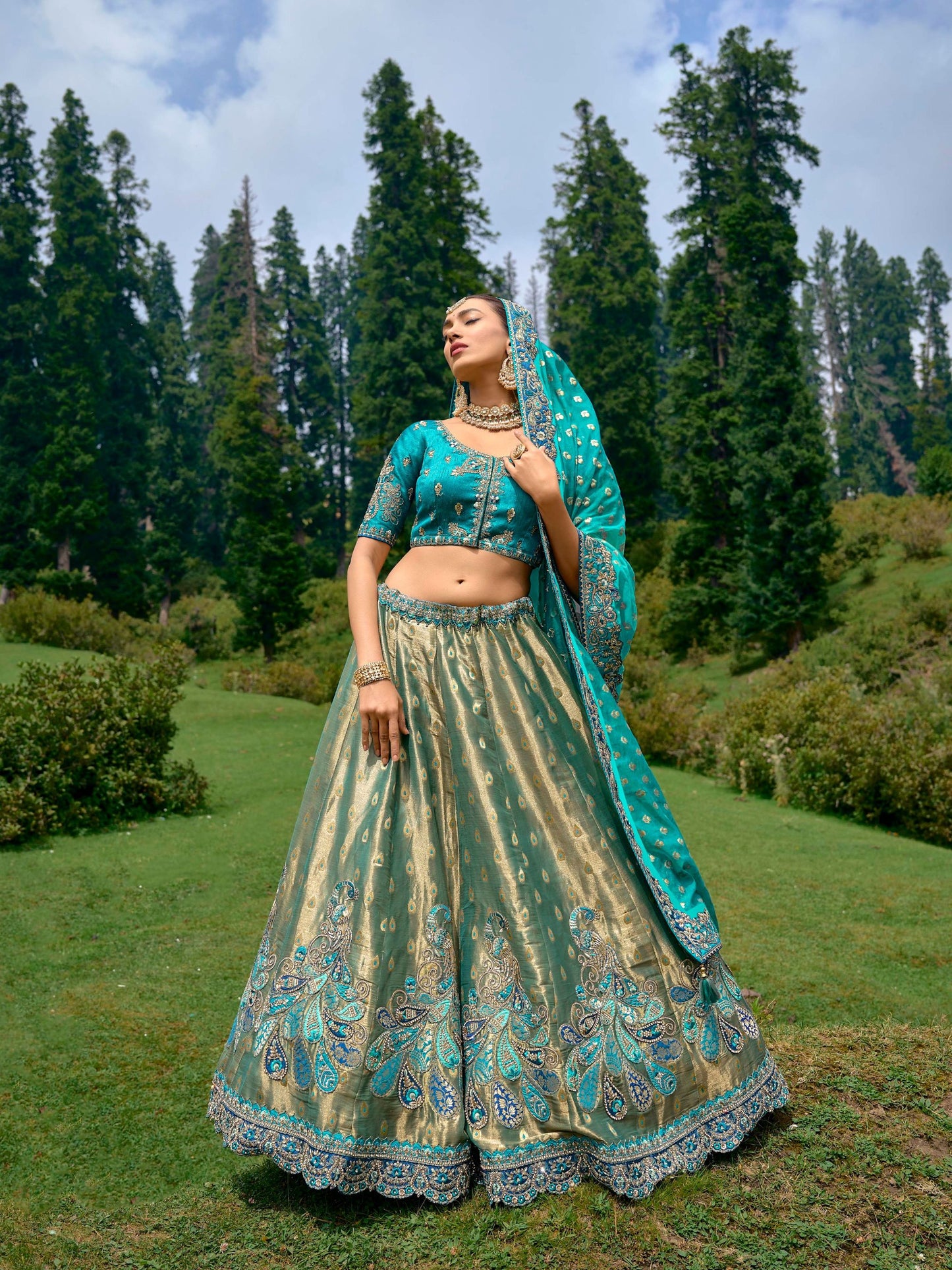 Teal Blue Color Silk Heavy Embroidered Lehenga Choli - Rent