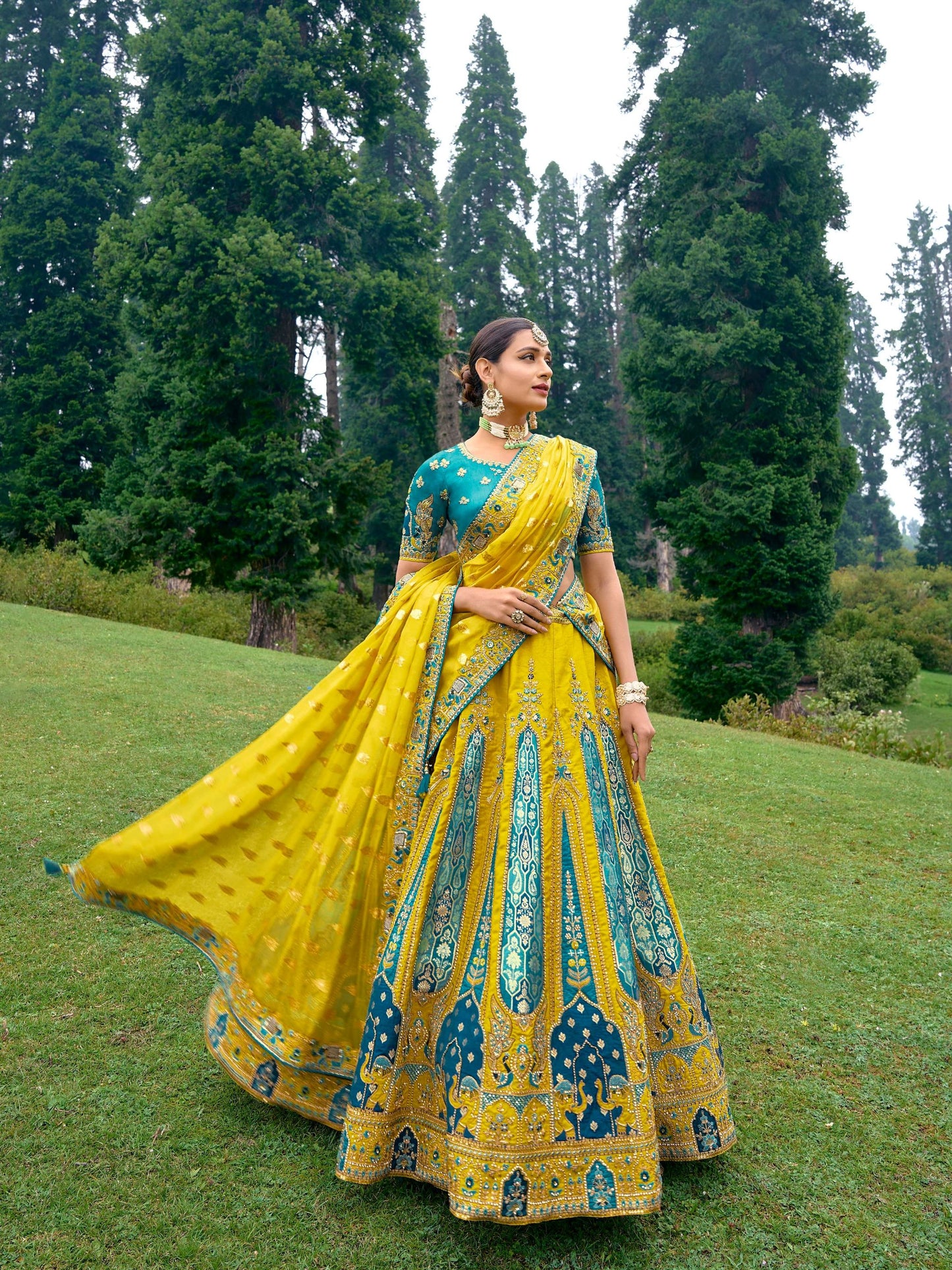 Yellow color Silk Heavy Embroidered Lehenga Choli - Rent