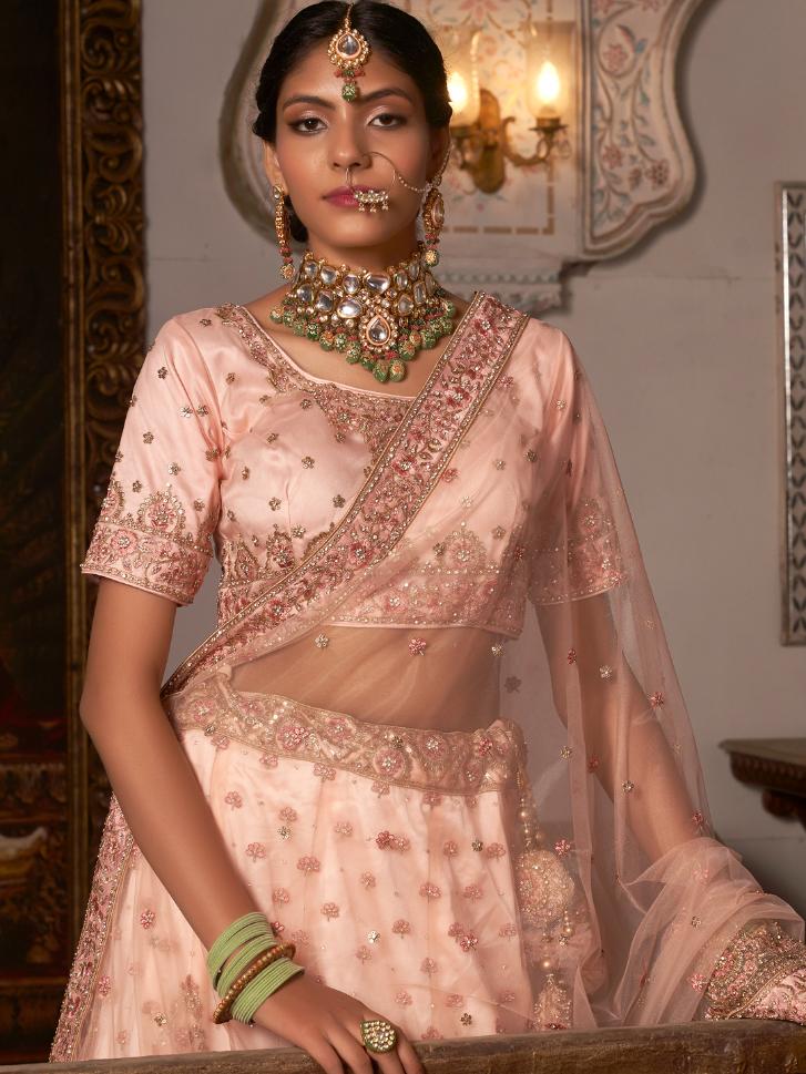 Peach Heavy Embroidered Net Lehenga Choli