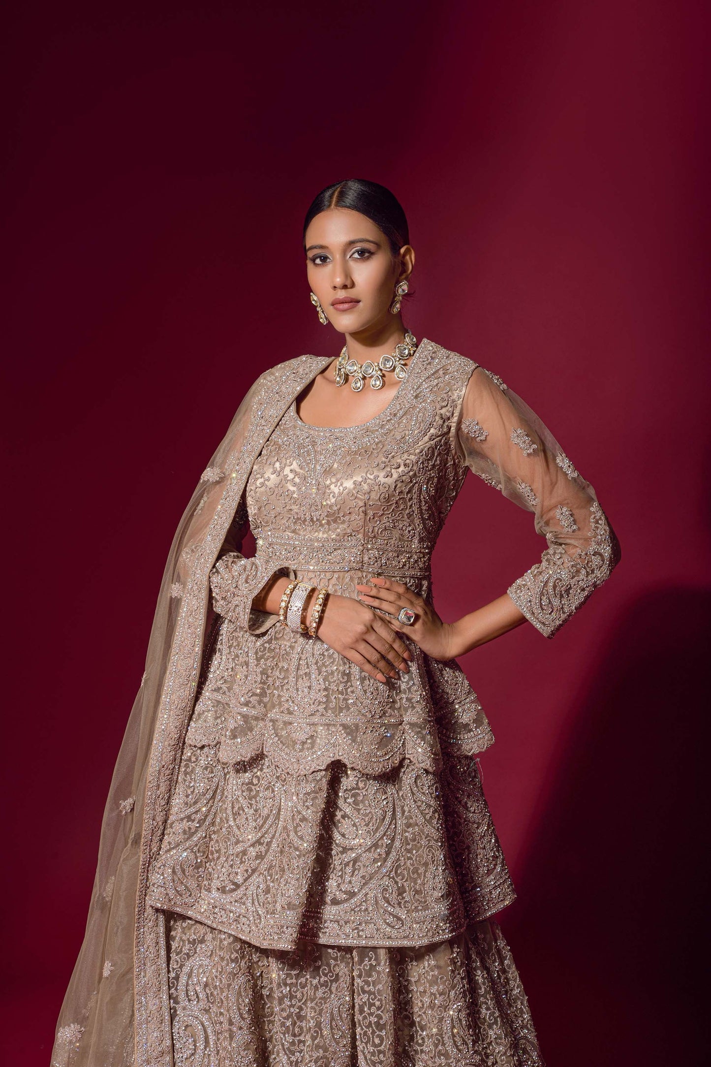 Ravishing Beige Peplum Jacket Velvet Lehenga Set